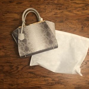 Snake skin print handbag